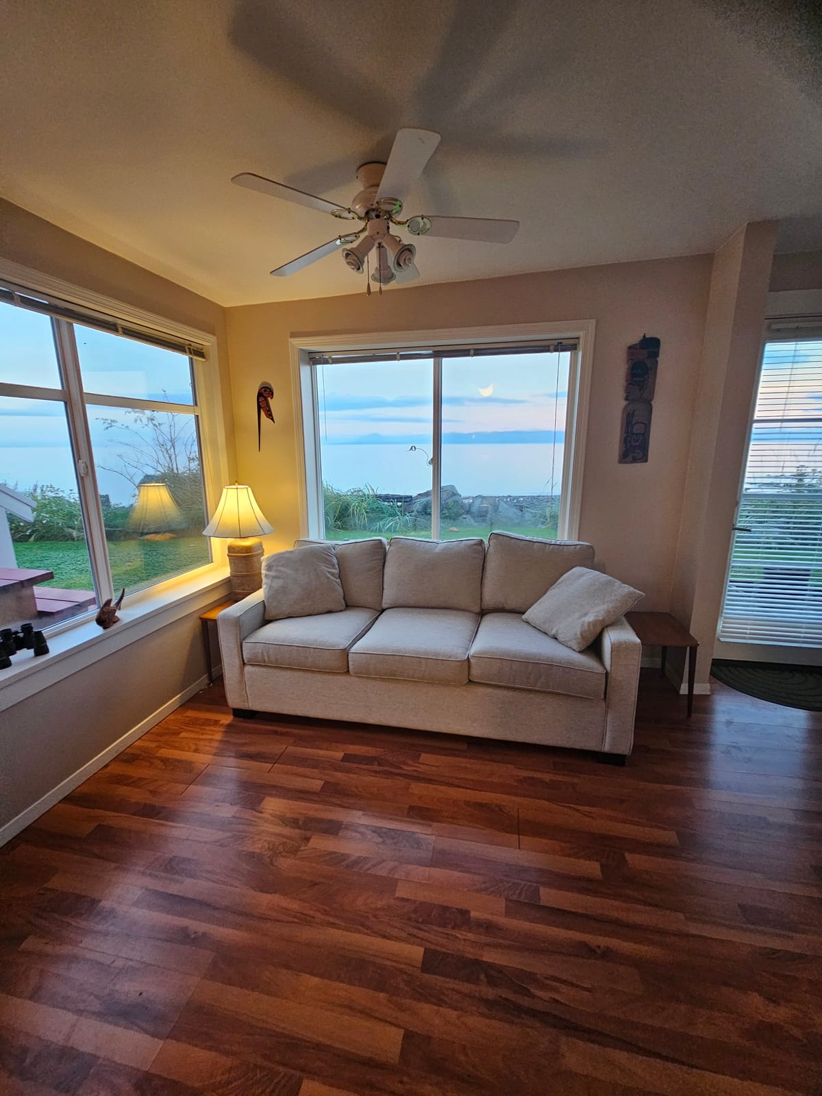 Living room with corner windows and ocean view