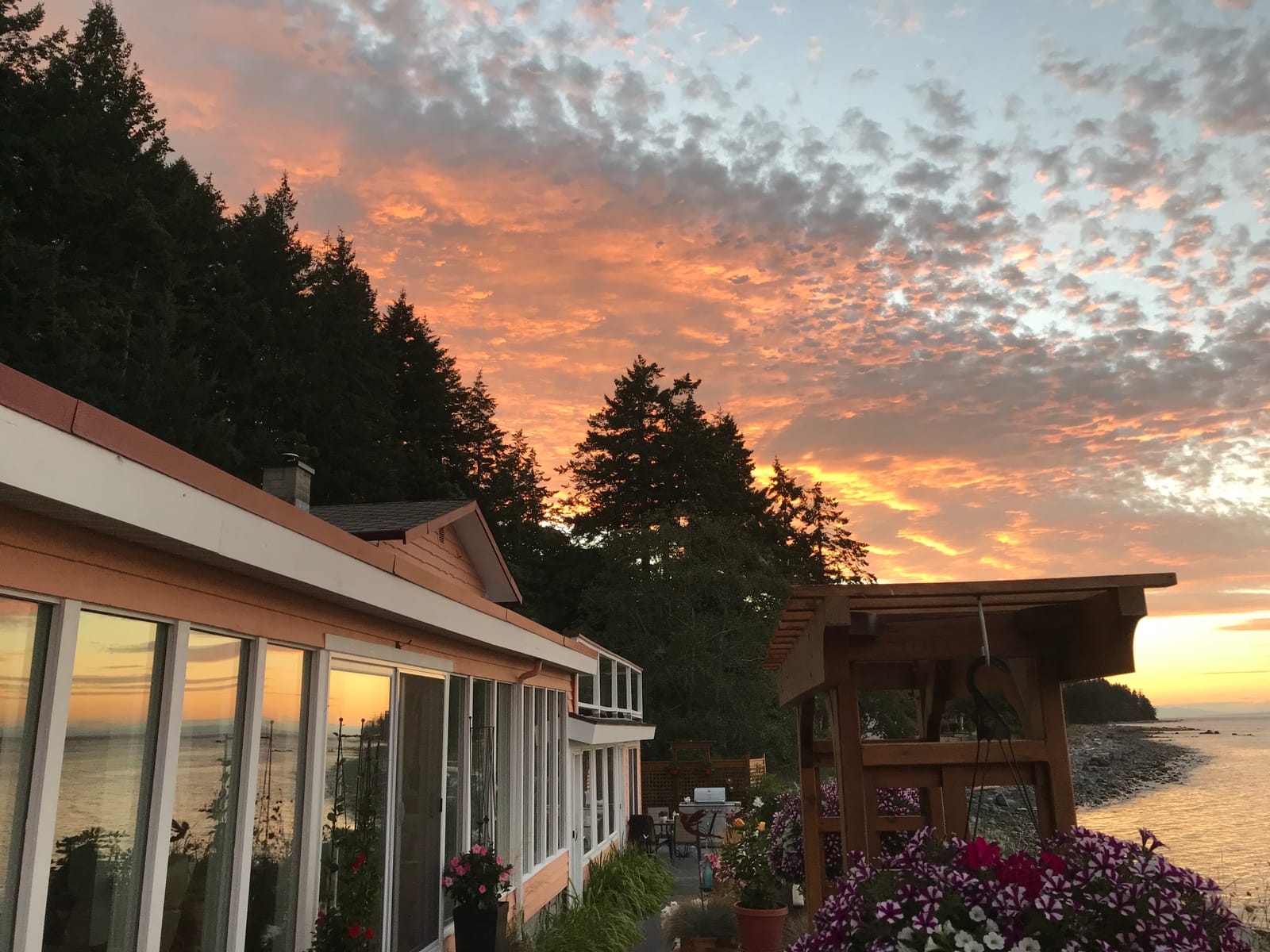 Twilight sky over the property and shoreline
